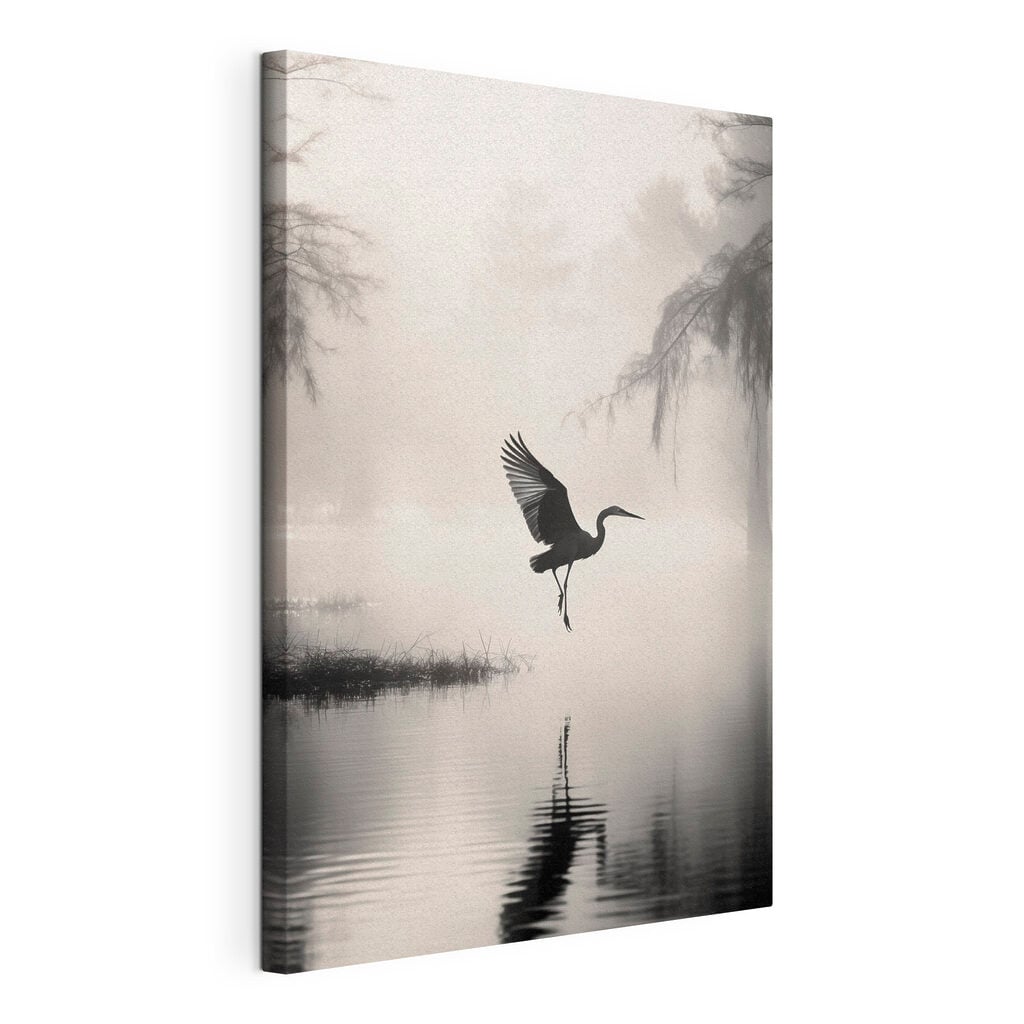 Bird flying over water